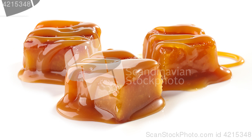 Image of caramel candies on white background