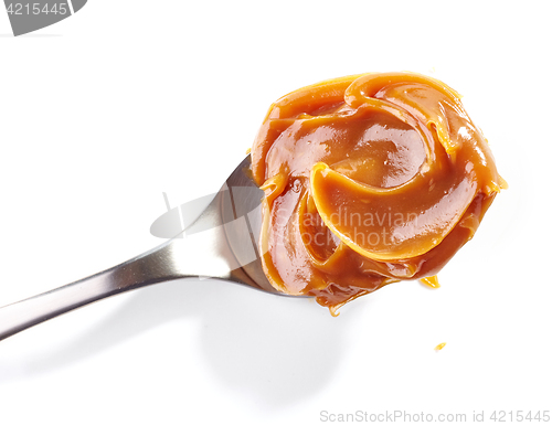 Image of spoon of soft homemade caramel