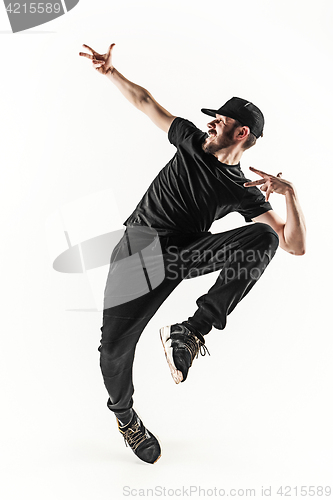 Image of The silhouette of one hip hop male break dancer dancing on white background