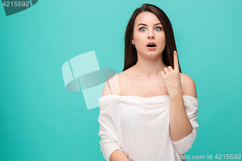 Image of Portrait of young woman with shocked facial expression