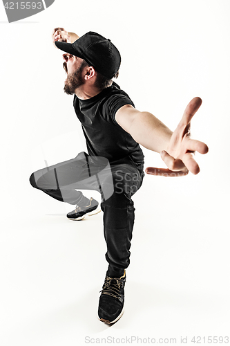 Image of The silhouette of one hip hop male break dancer dancing on white background