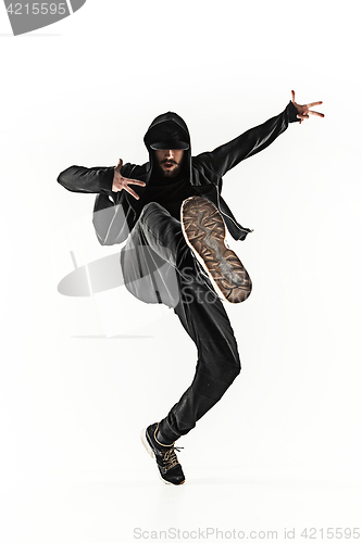 Image of The silhouette of one hip hop male break dancer dancing on white background