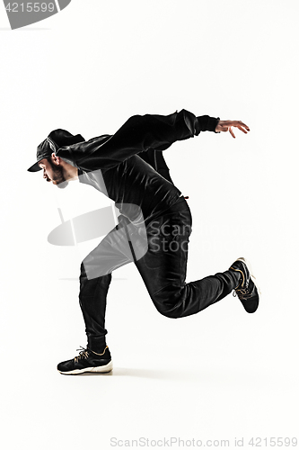 Image of The silhouette of one hip hop male break dancer dancing on white background