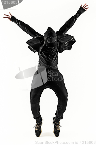 Image of The silhouette of one hip hop male break dancer dancing on white background