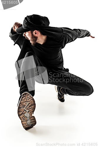 Image of The silhouette of one hip hop male break dancer dancing on white background