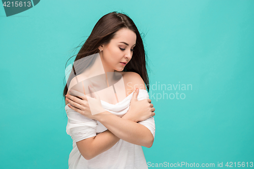 Image of Frustrated young woman posing on blue