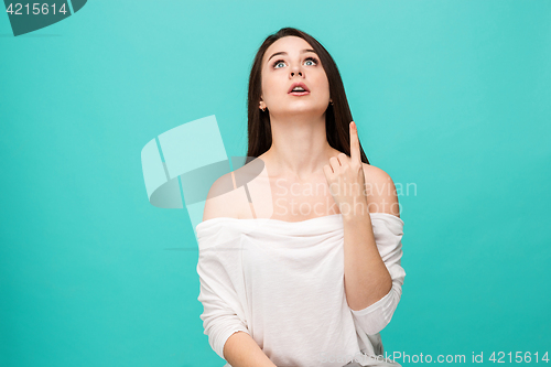 Image of Portrait of young woman with shocked facial expression