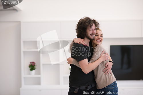 Image of couple hugging in their new home