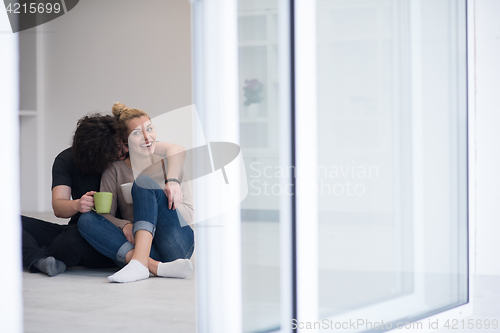 Image of young couple in their new home