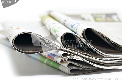 Image of Newspapers folded and stacked