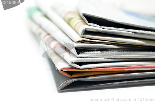 Image of Newspapers folded and stacked