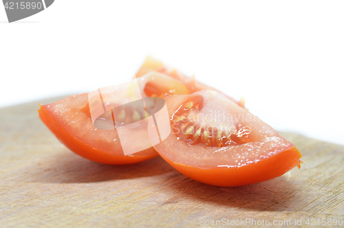 Image of Slice red tomato isolated