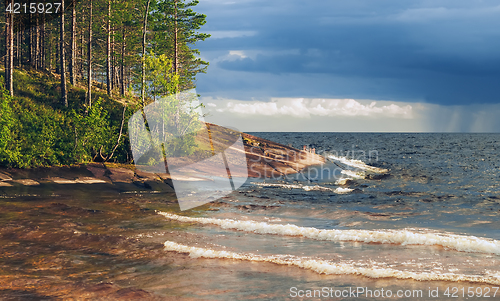 Image of Granite Shore Of Lake Before The Storm