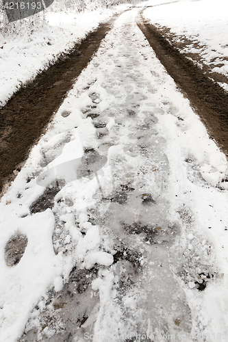 Image of traces of the car on snow