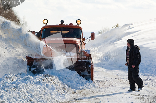 Image of truck cleaning road in winter