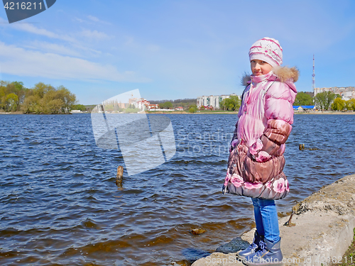 Image of Schoolgirl on the dam in early spring