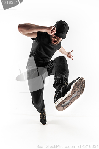 Image of The silhouette of one hip hop male break dancer dancing on white background