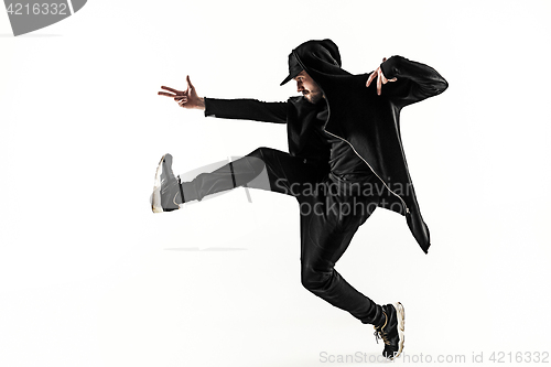 Image of The silhouette of one hip hop male break dancer dancing on white background