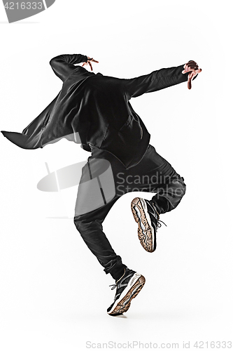 Image of The silhouette of one hip hop male break dancer dancing on white background