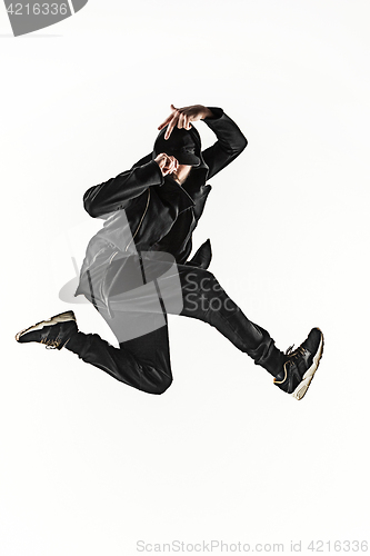 Image of The silhouette of one hip hop male break dancer dancing on white background