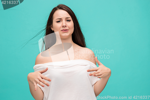 Image of Frustrated young woman posing on blue