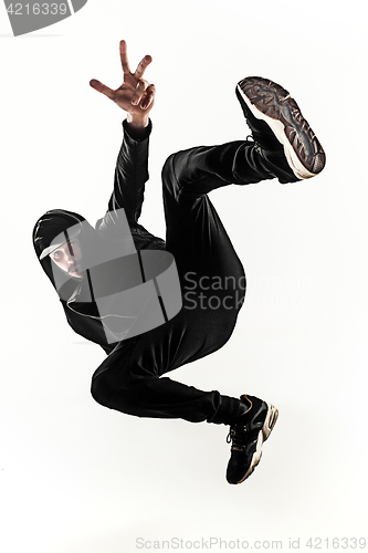 Image of The silhouette of one hip hop male break dancer dancing on white background
