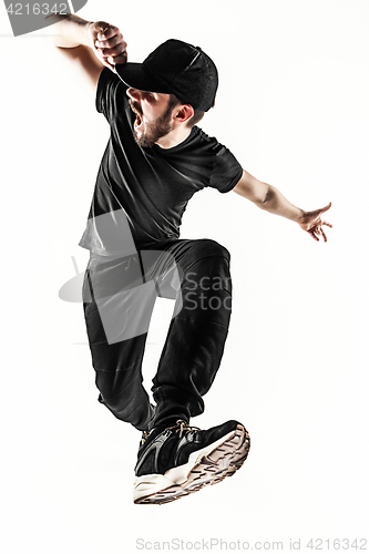 Image of The silhouette of one hip hop male break dancer dancing on white background