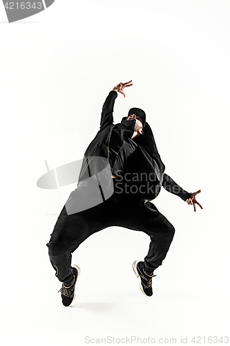 Image of The silhouette of one hip hop male break dancer dancing on white background