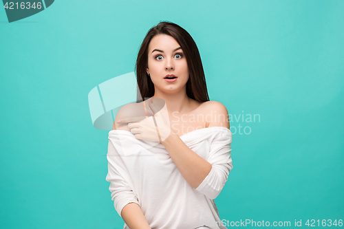 Image of Portrait of young woman with shocked facial expression