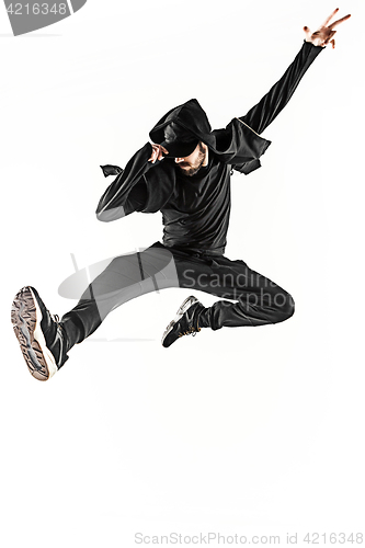 Image of The silhouette of one hip hop male break dancer dancing on white background