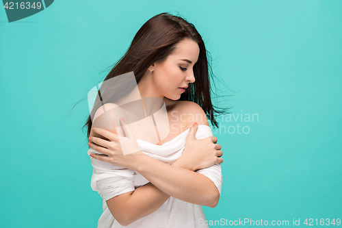 Image of Frustrated young woman posing on blue