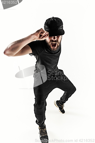 Image of The silhouette of one hip hop male break dancer dancing on white background