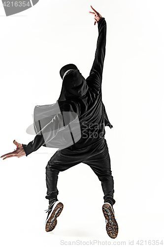 Image of The silhouette of one hip hop male break dancer dancing on white background