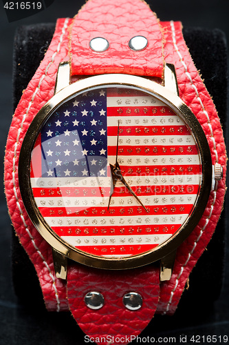 Image of clock on a black background. American Flag