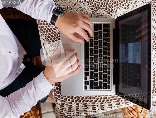 Image of Closeup of businessman typing on laptop computer