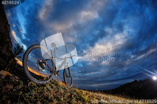 Image of Mountain bike against sunset