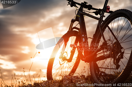 Image of Mountain bike against sunset