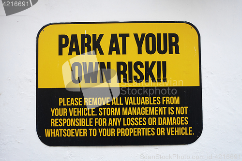 Image of Park at your own risk sign 