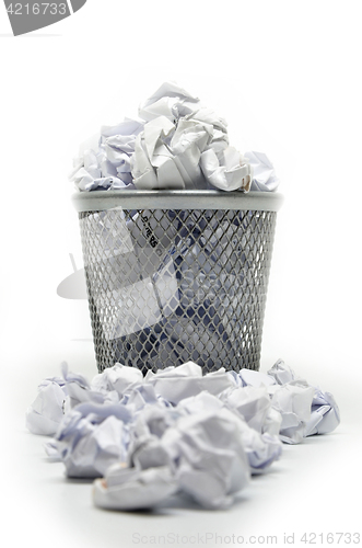 Image of Garbage bin with paper waste