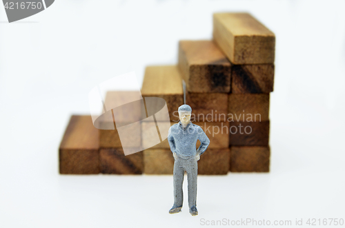 Image of Way to success with  businessman and wood block step