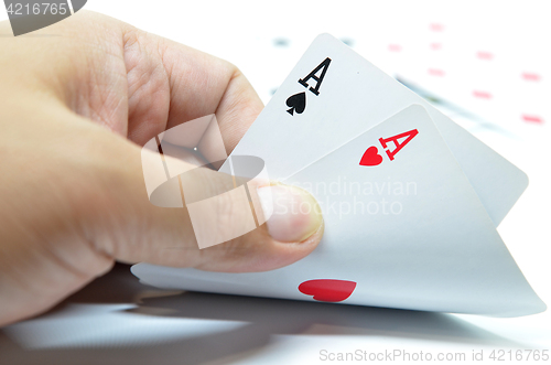 Image of Hand with poker cards