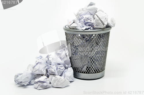 Image of Garbage bin with paper waste