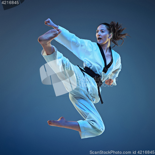 Image of The karate girl with black belt