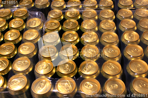 Image of packing of tins of beer