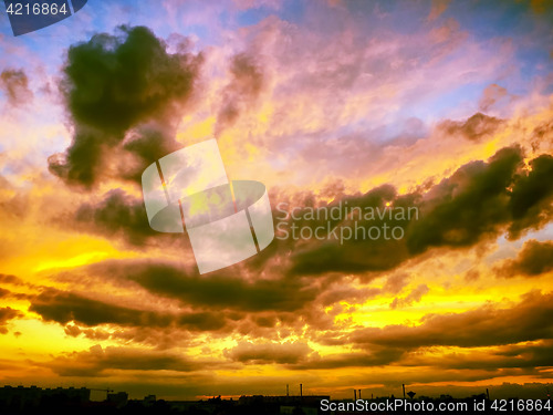 Image of Dramatic sunset like fire in the sky with golden clouds collage