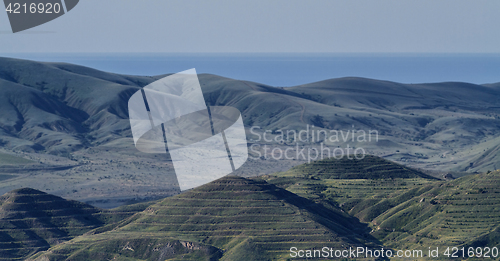 Image of Crimean barrows on a background of mountains, sea and sky