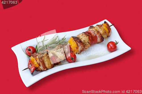 Image of Skewers of meat and vegetables on the grill