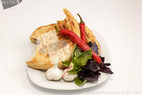 Image of vegetables on a plate with a slice of bread