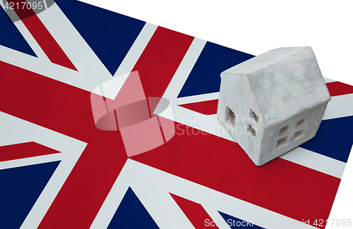 Image of Small house on a flag - UK
