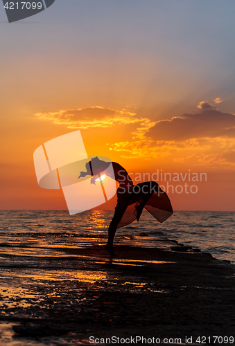 Image of girl at sunset